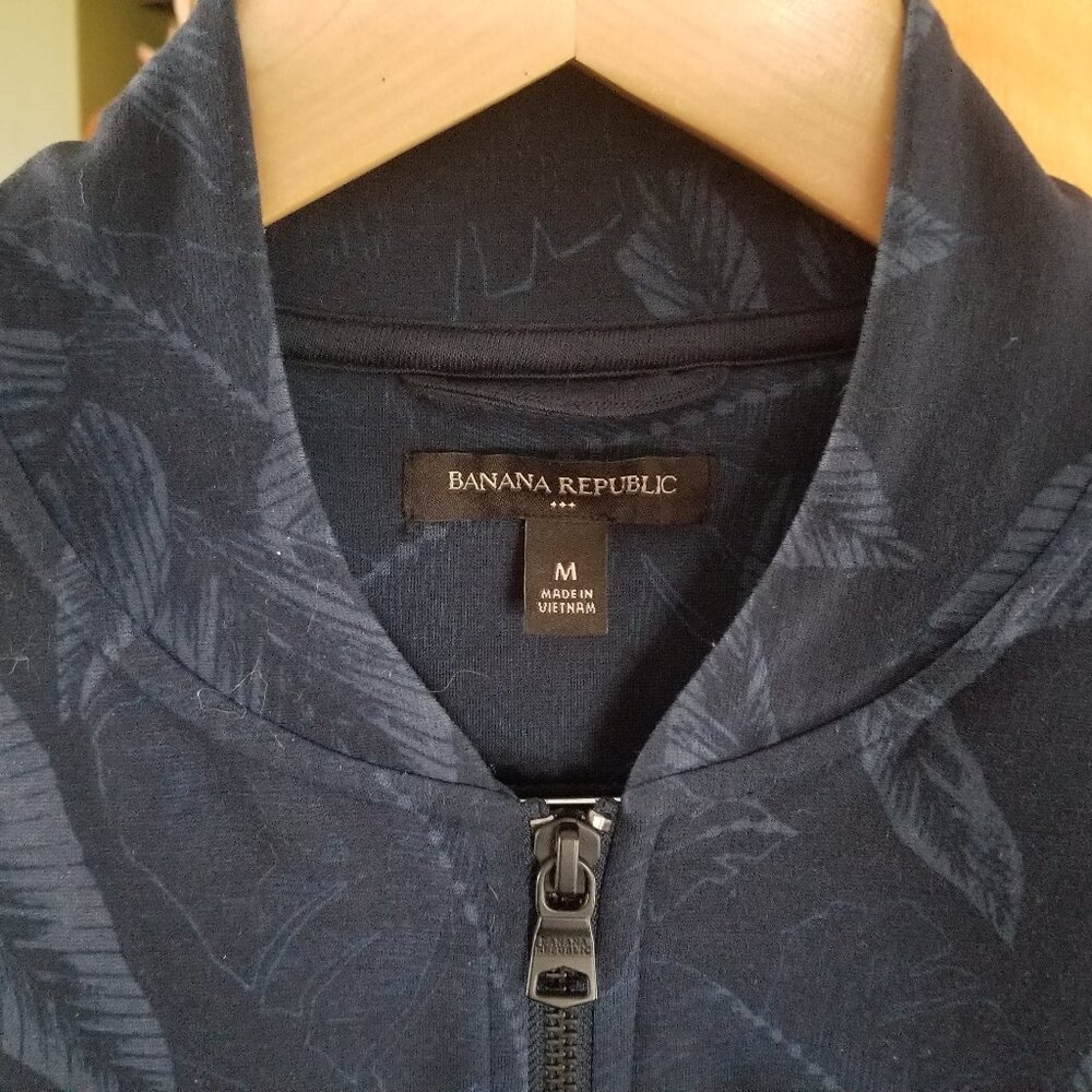Navy blue leaf pattern bomber style jacket